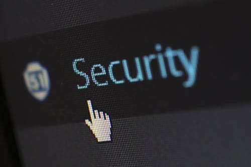 A cursor on a security icon