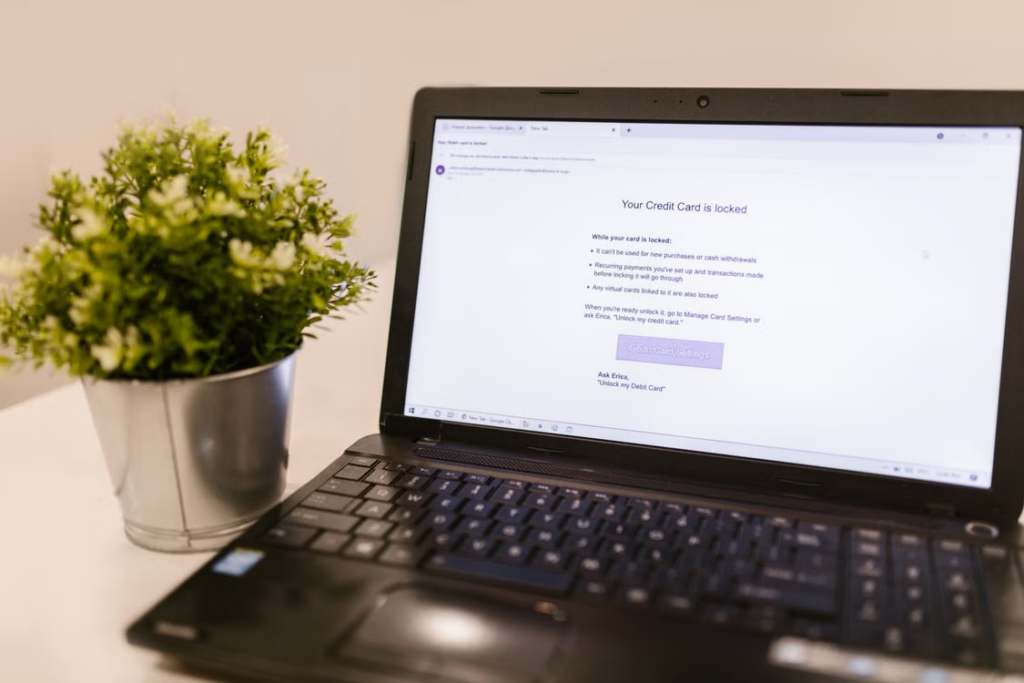 A laptop screen displaying a locked credit card notification