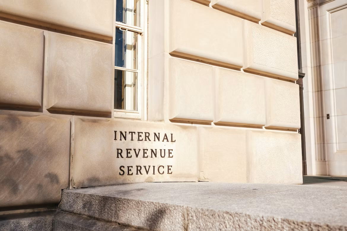 The exterior of the Internal Revenue Service building with engraved text on stone